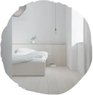 Interiérový pohled na minimalistickou ložnici s podlahou Oakcent Ivory, jejíž krémově bílý odstín navozuje vítající atmosféru a pocit maximální čistoty prostoru.